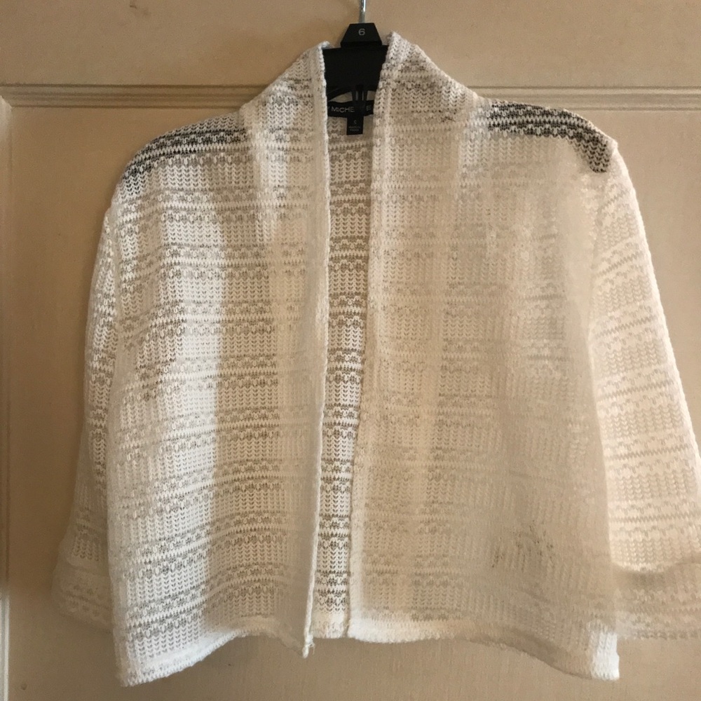 Girl’s white crocheted sweater
